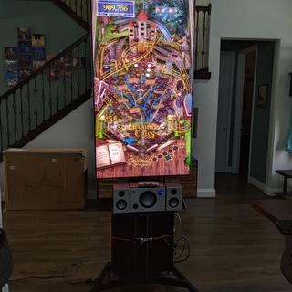 TV on with pinball.. can easily rotatevto tradional.   This is at max height.. top is over 7ft.