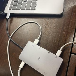 Plugged in with charging MacBook, iPhone, and iPad.