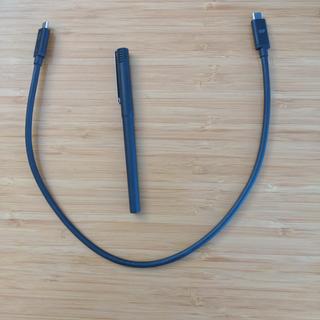 Cable with a regular pen for scale, both for length as well as thickness.