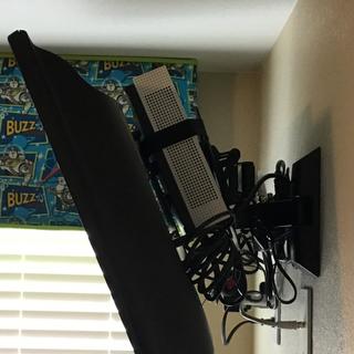 Mounted behind a 32 inch hdtv using a full articulating arm