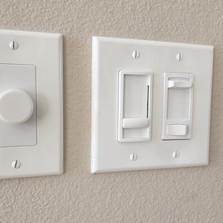 Volume control next to light dimmers.
