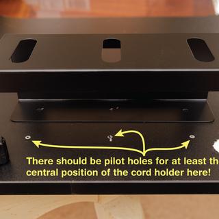 Cord holder for back uses self-tapping screws. Not a great idea.