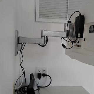 Monoprice HDMI extender on back of wall-mounted TV connects to in-wall wiring via Ethernet cable.