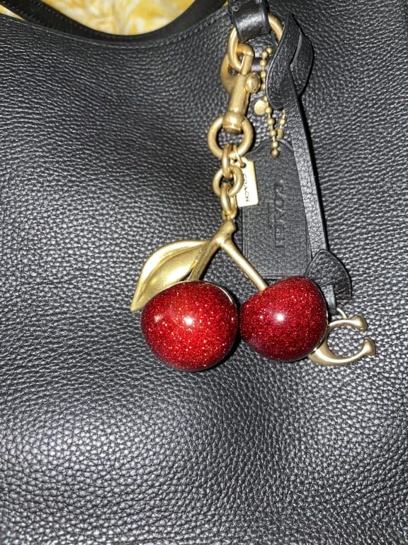 Elevate Your Style with the Coach Bag Charm Cherry: A Comprehensive Guide