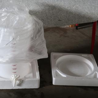 The styrofoam keeps the spigot off the floor or table.